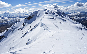 A group of winter walkers approaching the summit of Beinn Dorain  in the Scottish Highlands, Scotland, United Kingdom, Europe