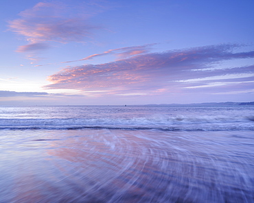 Tranquil dawn with clouds reflected in the wet beach, Exmouth, Devon, England, United Kingdom, Europe