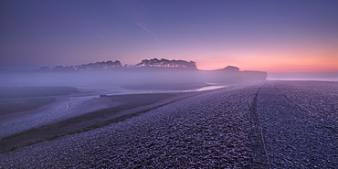 Winter twilight and heavy band of mist from River Otter at Budleigh Salterton, Devon, England, United Kingdom, Europe