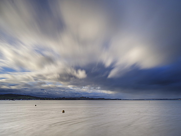 Stormy rain clouds blow down the Exe estuary at Exmouth, Devon, England, United Kingdom, Europe