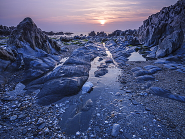 Sunset looking out to sea from Combesgate Beach near Woolacombe, Devon, England, United Kingdom, Europe