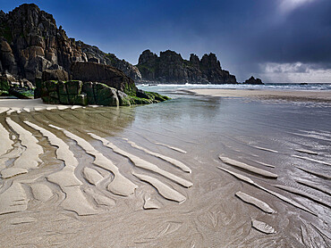 The beautiful and secluded beach at Pedn Vounder overlooks Logan Rock, near Porthcurno, Cornwall, England, United Kingdom, Europe