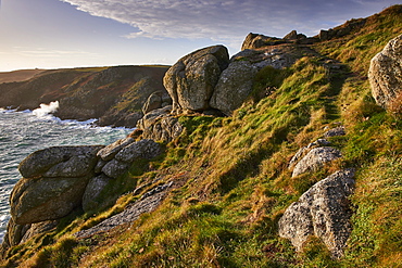 Warm light on Rospletha cliff, Porthchapel, Porthcurno, Cornwall, England, United Kingdom, Europe