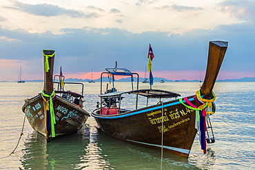 Long tail boats at sunset on Railay beach in Railay, Ao Nang, Krabi Province, Thailand, Southeast Asia, Asia