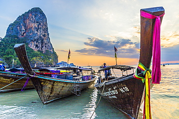 Long tail boats at sunset on Railay beach in Railay, Ao Nang, Krabi Province, Thailand, Southeast Asia, Asia