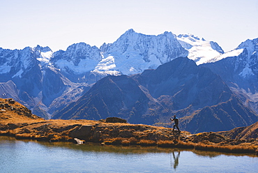 Mountain trekker in autumn season in Stelvio National Park in Brescia Province, Lombard, Italy, Europe