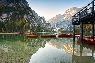 Lake of Braies in autumn with the typical boats of the place, Bolzano Province, Trentino-Alto Adige, Italy, Europe