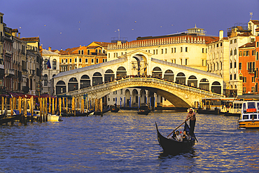 Sunset over Rialto Bridge in Venice, Venezia province in Veneto district, Italy.