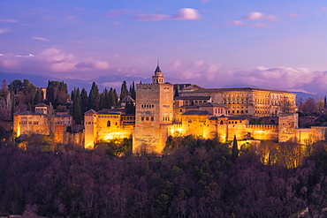 View of the Alhambra, UNESCO World Heritage Site, with the Sierra Nevada mountains in the background, at sunset, Granada, Andalucia, Spain, Europe