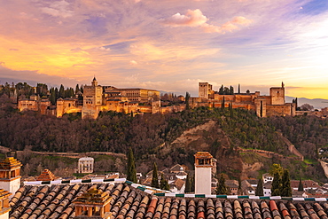 View of the Alhambra, UNESCO World Heritage Site, with the Sierra Nevada mountains in the background, at sunset, Granada, Andalucia, Spain, Europe