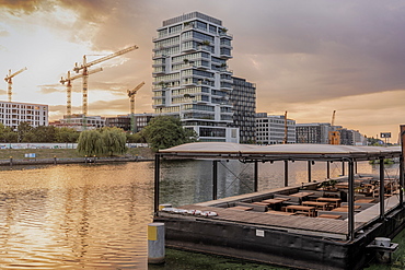 View of the Spree River after sunrise in Berlin with modern buildings in the background, Berlin, Germany, Europe