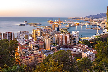 View from the view point of Gibralfaro by the castle with the La Malagueta bullring and the harbor at sunrise, Malaga, Andalusia, Spain, Europe