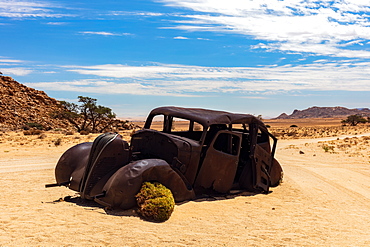 An Abandoned car that was shot down in a Diamond Heist in 1934 within Aus Vista, Namibia, Africa