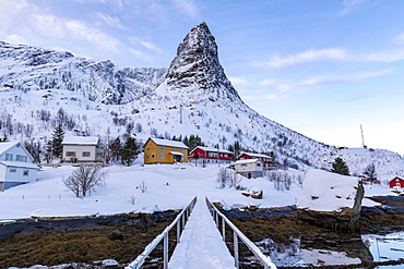 Pointed mountain of Reine with footbridge in winter, Reine, Lofoten, Nordland, Arctic, Norway, Europe