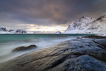 Rock formation in winter at Haukland Beach, Lofoten, Nordland, Norway, Europe