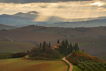 Podere Belvedere and Tuscan countryside with dramatic sky, San Quirico d'Orcia, Tuscany, Italy, Europe