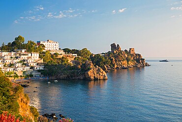 View across the tranquil waters of Calura Bay, sunrise, ancient watchtower visible on headland, Cefalu, Palermo, Sicily, Italy, Mediterranean, Europe