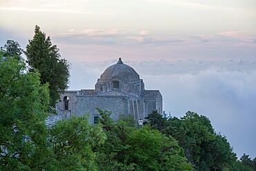 The hilltop Church of San Giovanni Battista, low cloud obscuring the landscape beyond, Erice, Trapani, Sicily, Italy, Mediterranean, Europe