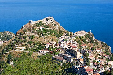 View over wooded valley to the Saracen castle and distant Ionian Sea, Castelmola, Taormina, Messina, Sicily, Italy, Mediterranean, Europe