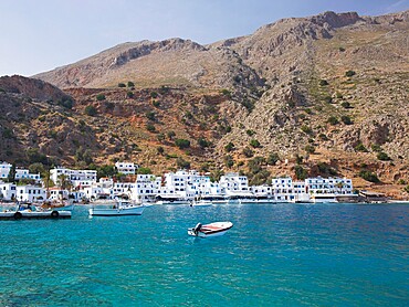 View across the clear turquoise waters of the harbour, Loutro, Hania (Chania), Crete, Greek Islands, Greece, Europe