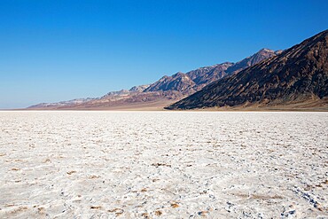 View across vast expanse of salt flats to the Black Mountains, Badwater Basin, Death Valley National Park, California, United States of America, North America