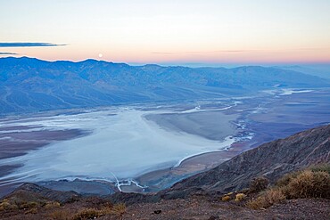 View by moonlight over Badwater Basin to the Panamint Range, Dante's View, Death Valley National Park, California, United States of America, North America