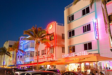 Colourful hotel facades illuminated by night, Ocean Drive, Art Deco Historic District, South Beach, Miami Beach, Florida, United States of America, North America