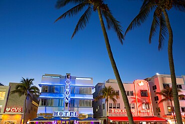 Colourful hotel facades illuminated by night, Ocean Drive, Art Deco Historic District, South Beach, Miami Beach, Florida, United States of America, North America