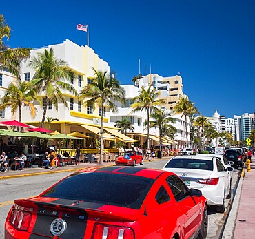 View along Ocean Drive, red Ford Mustang in foreground, Art Deco Historic District, South Beach, Miami Beach, Florida, United States of America, North America