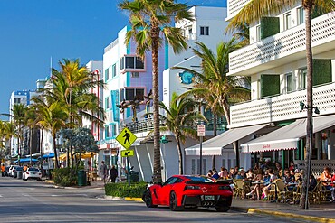 View along Ocean Drive, red Chevrolet Corvette prominent, Art Deco Historic District, South Beach, Miami Beach, Florida, United States of America, North America