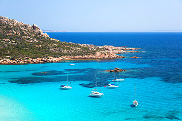 View from hillside over the turquoise waters of the Cala di Roccapina, yachts at anchor, Sartene, Corse-du-Sud, Corsica, France, Mediterranean, Europe