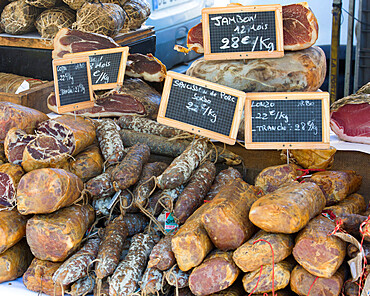 Selection of Corsican sausages and hams for sale at open-air market in Place Foch, Ajaccio, Corse-du-Sud, Corsica, France, Mediterranean, Europe