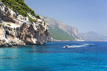 Speedboat heading towards Cala Mariolu, Gulf of Orosei National Park, Santa Maria Navarrese, Baunei, Nuoro, Sardinia, Italy, Mediterranean, Europe