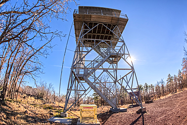 Fisheye view from below the fire watchtower on the summit of Apache Maid Mountain in the Coconino National Forest of Arizona. The tower is public property and open to the public. No property release is needed.