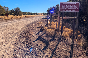 A warning sign in the Coconino National Forest of Arizona stating that this road can be closed seasonally.