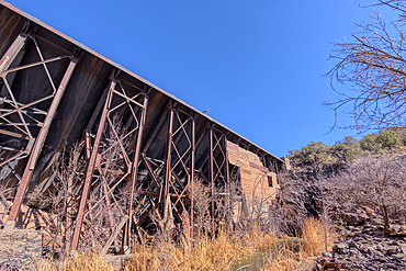 View from below the historic Bainbridge Steel Dam near Ash Fork Arizona in the Kaibab National Forest. It was originally constructed in the late 1800s and is now a historic landmark that is open to the public.