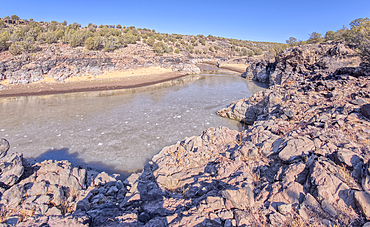 View of the lake created by the historic Bainbridge Steel Dam near Ash Fork Arizona in the Kaibab National Forest. It was originally constructed in the late 1800s and is now a historic landmark that is open to the public.