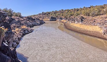 View of the lake created by the historic Bainbridge Steel Dam near Ash Fork Arizona in the Kaibab National Forest. It was originally constructed in the late 1800s and is now a historic landmark that is open to the public.