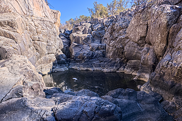 Dry waterfall cliffs in a section of Johnson Canyon halfway between the Bainbridge Steel Dam and Stone Dam near Ash Fork Arizona in the Kaibab National Forest.