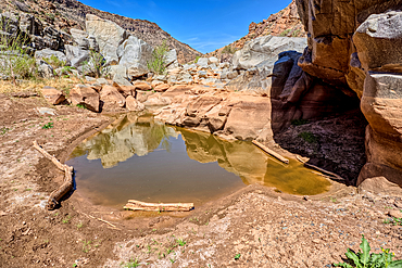An ephemeral pool of water in the granite riverbed of the Agua Fria River Canyon in the Agua Fria National Monument of Arizona.