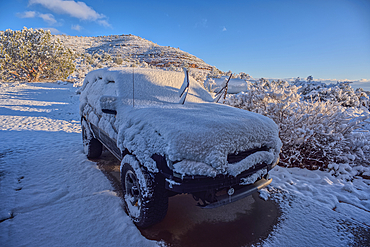 A snow covered vehicle from a late winter storm the night before in Chino Valley Arizona.