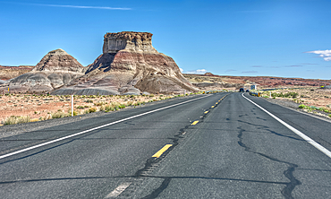 A butte of Bentonite clay along highway US89 north of Cameron Arizona in an area called the Painted Desert. This photo was taken thru the windshield of a vehicle in motion.