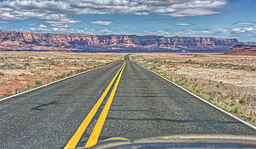 Vermilion Cliffs National Monument Arizona viewed thru the windshield of a moving vehicle traveling on highway US89A.