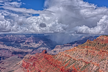 A rain storm over the North Rim of Grand Canyon National Park Arizona. Viewed from the Pipe Creek Vista on the South Rim.