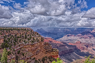 A rain storm over the North Rim of Grand Canyon National Park Arizona. Viewed from the Pipe Creek Vista on the South Rim.
