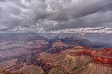 A rain storm over the North Rim of Grand Canyon National Park Arizona. Viewed from Yavapai Point on the South Rim.