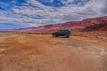 Vehicle parked next to Jackass Creek off of US89A near Echo Cliffs on the way to Vermilion Cliffs Arizona. Located on the Navajo Indian Reservation between Bitter Springs and Marble Canyon.