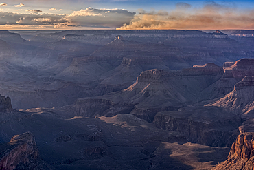 Smoke from the Dragon Bravo wildfire burning on the North Rim of Grand Canyon Arizona. Viewed from Shoshone Point on the South Rim. The fire started from a lightning strike on July 4th, 2025.