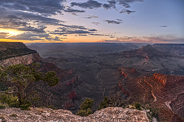 Smoke from the Dragon Bravo wildfire burning on the North Rim of Grand Canyon Arizona. Viewed from Shoshone Point on the South Rim. The fire started from a lightning strike on July 4th, 2025.