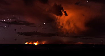 Dragon Bravo wildfire burning on the North Rim of Grand Canyon Arizona. Viewed from Pipe Creek Vista on the South Rim at night. The fire started from a lightning strike on July 4th, 2025. Due to high winds and long exposure time there is motion blur.